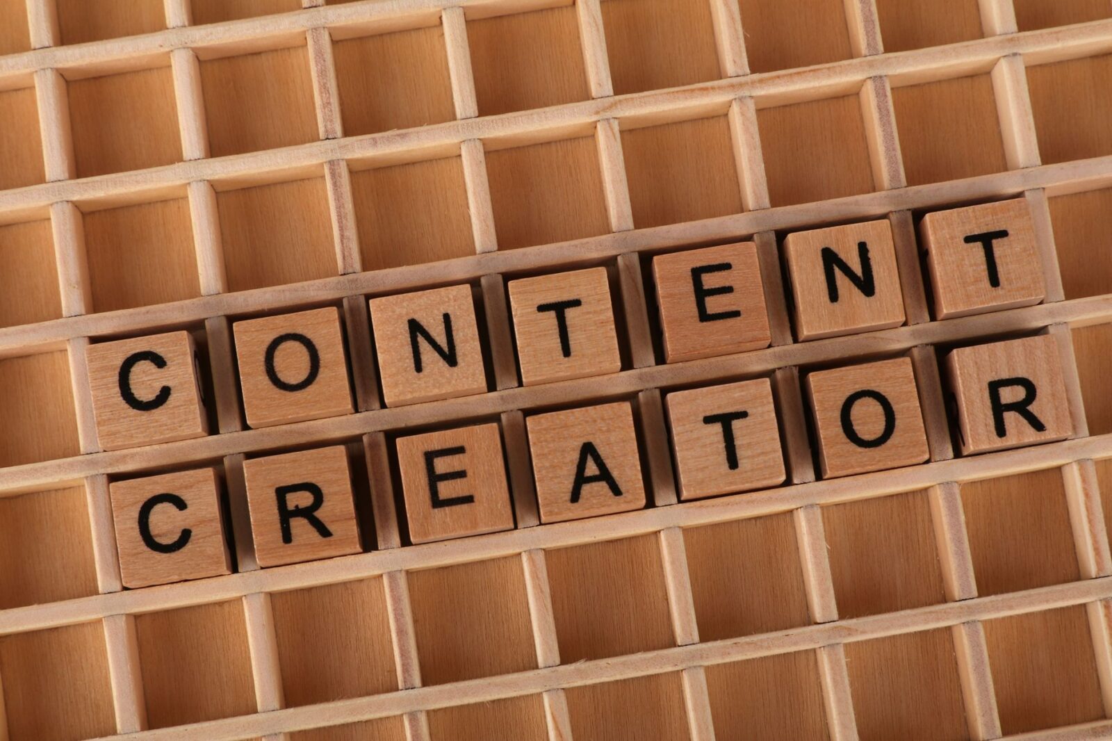 wooden block letters spelling content creator