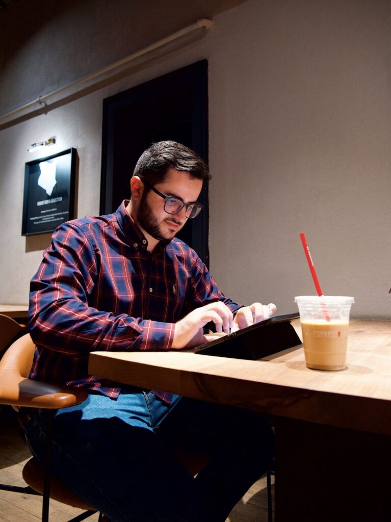 Man working on a tablet at a table