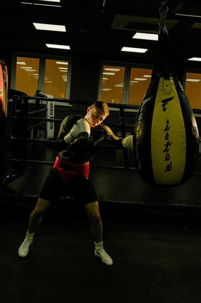 Boxer training with a heavy bag