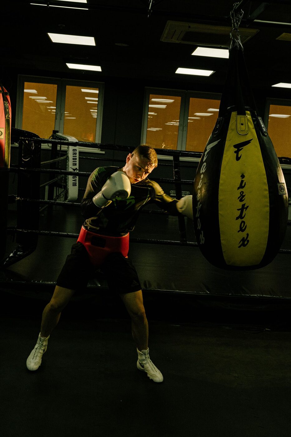Boxer training with a heavy bag